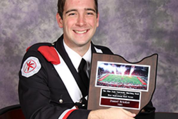 Daniel Brinker poses with his Most Inspirational Bandsperson award