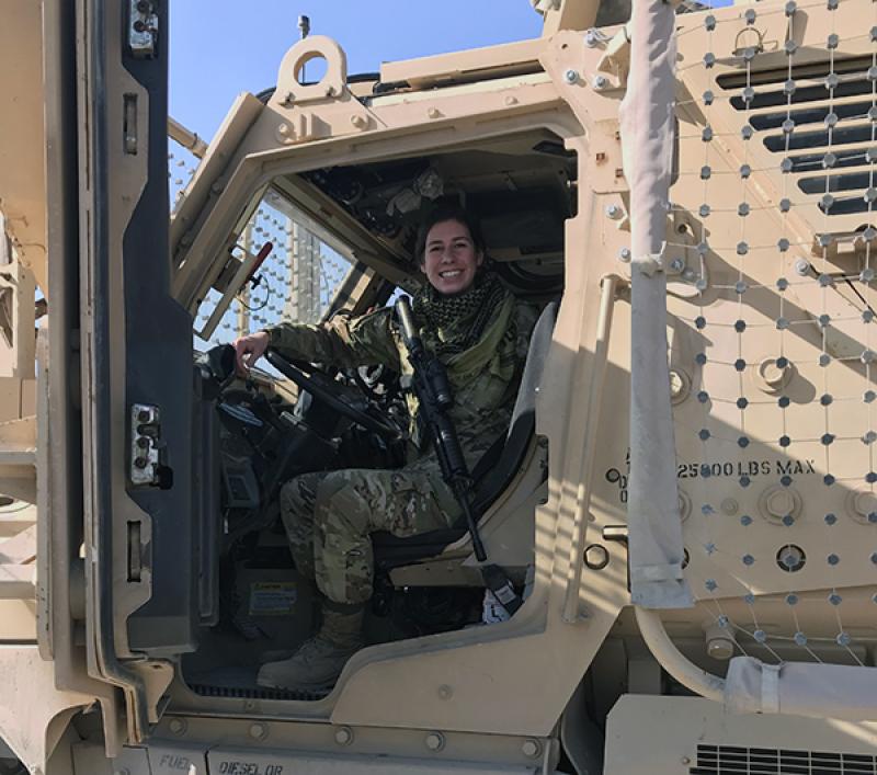 Sarah Wood in a military vehicle