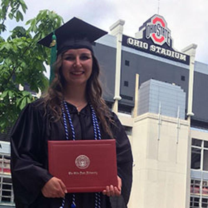 Haley Rohaley in cap and gown after earning her Ohio State degree in Spring 2018
