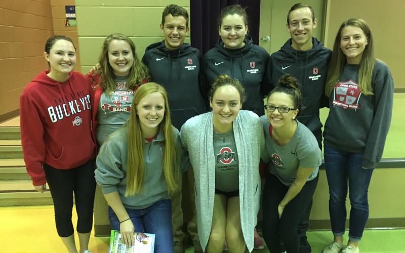 OSUMB members and Ohio State student-athletes pose for a picture