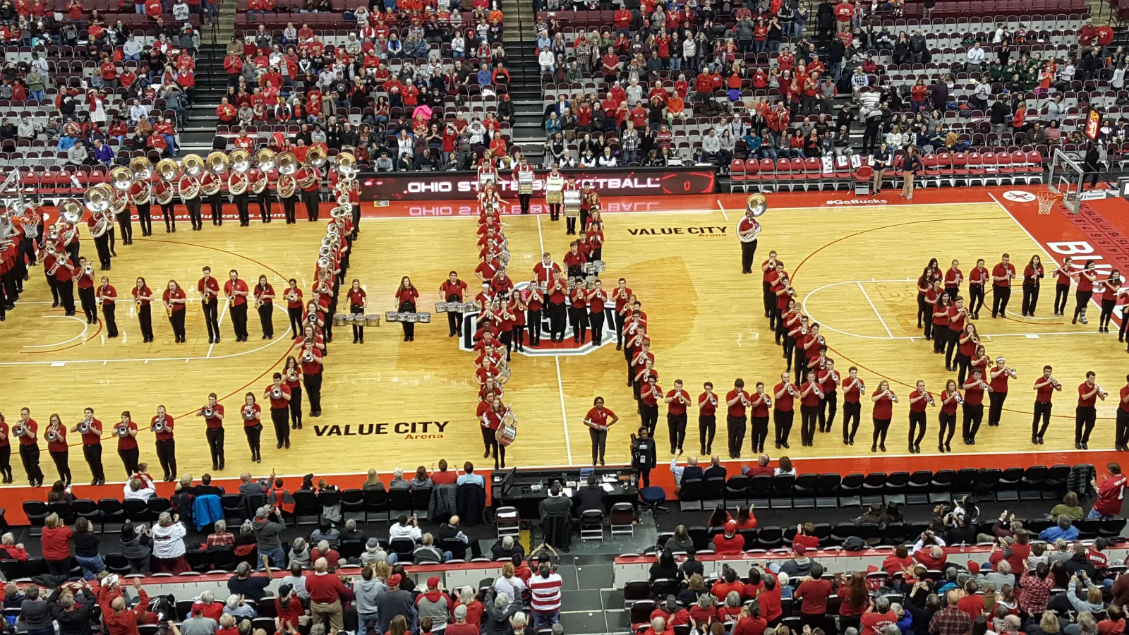 The Ohio State Athletic Band performs Script on Court at the women's basketball game on Feb. 1