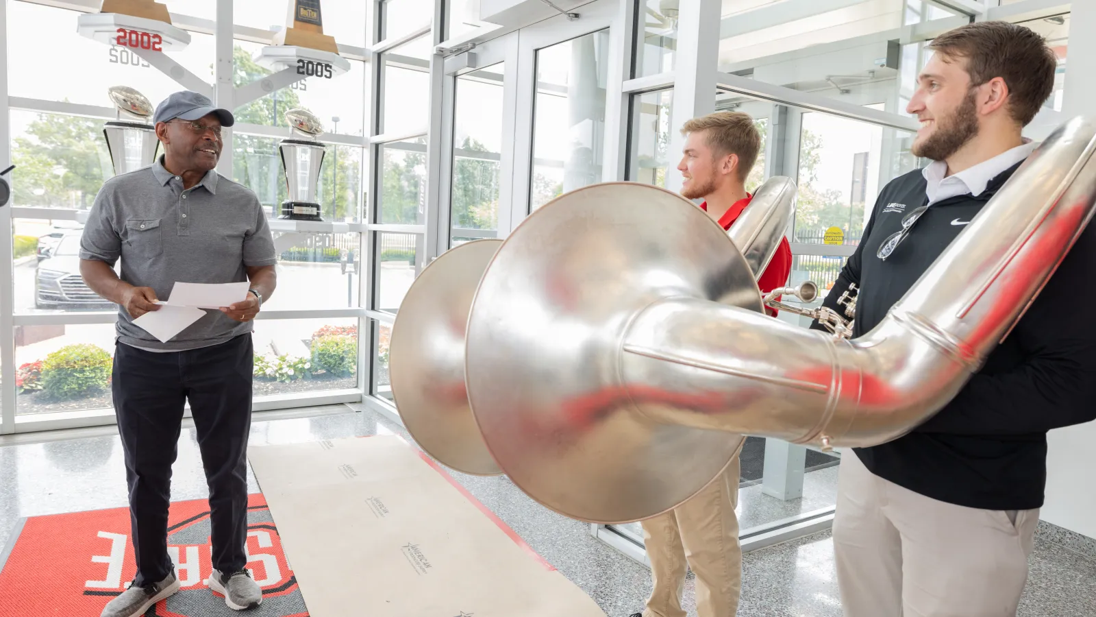 Archie Griffin reading invitation to Dot the "i"