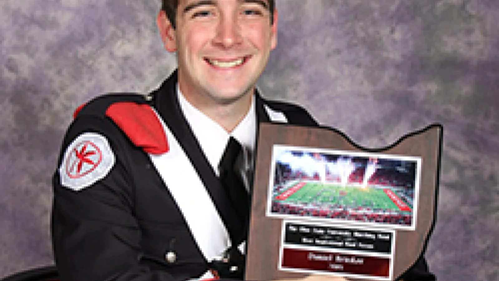 Daniel Brinker poses with his Most Inspirational Bandsperson award