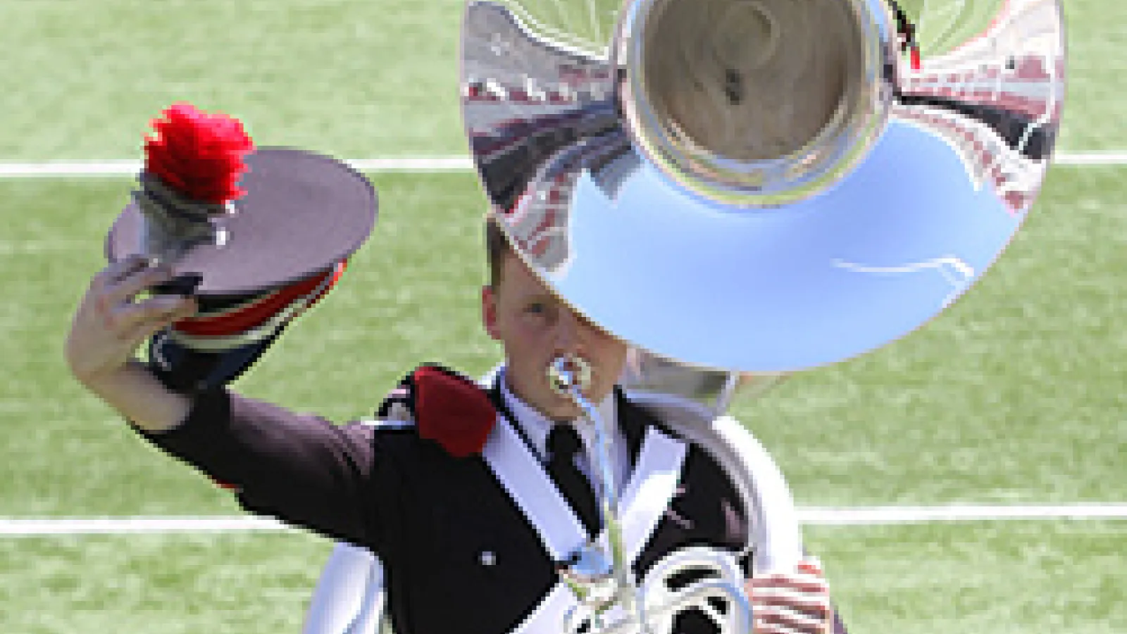 Tuba player takes his hat off to the crowd.
