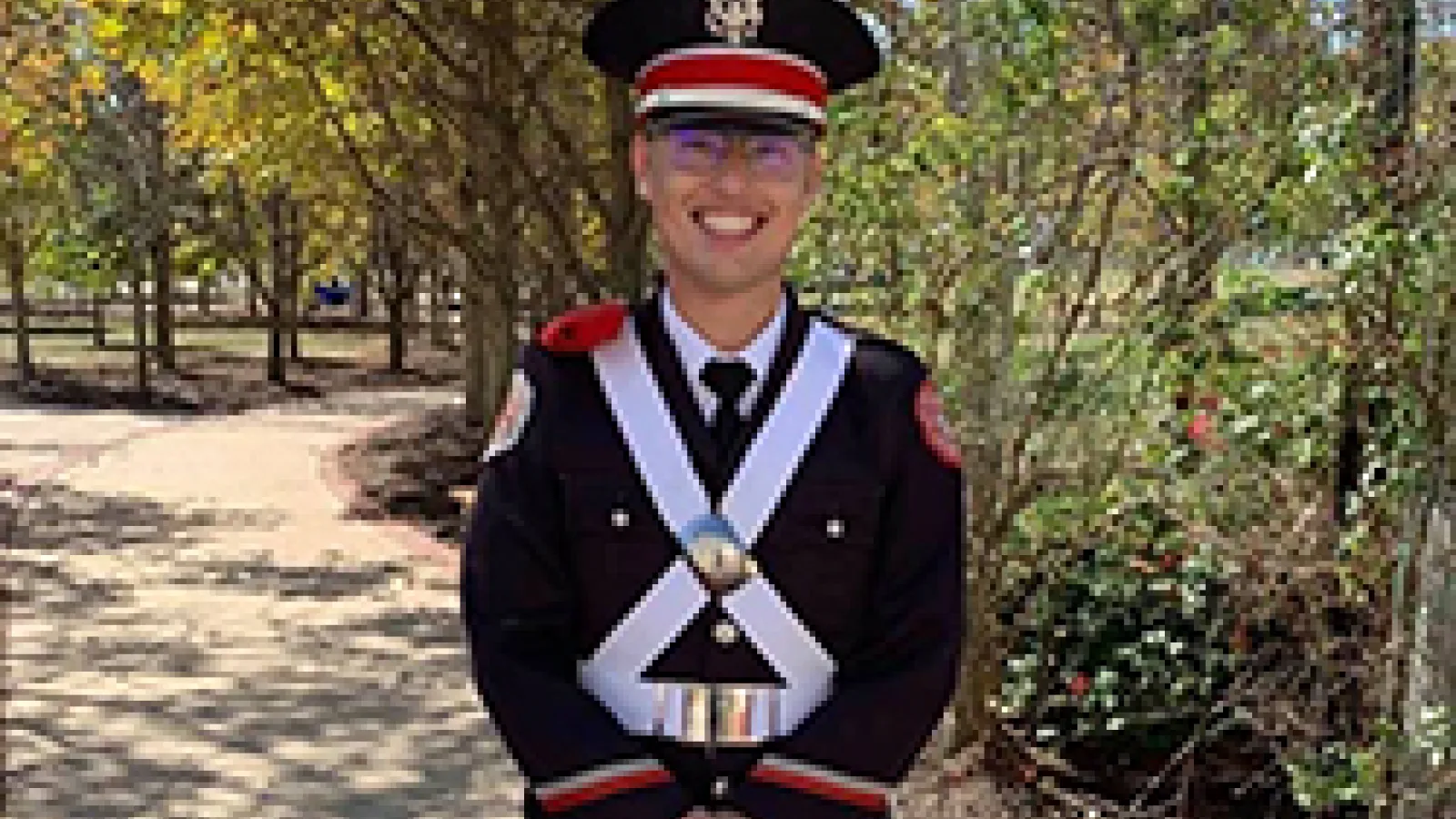 Christopher Lewis in marching band uniform