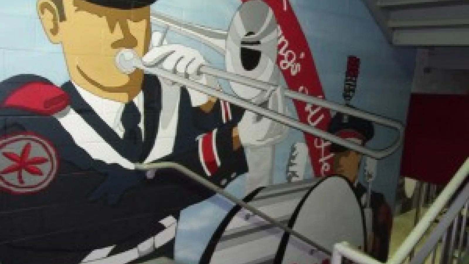 OSU Band Mural by artist Matt Adams appears in the stairwell leading to the Joan Zeig Steinbrenner Band Center.