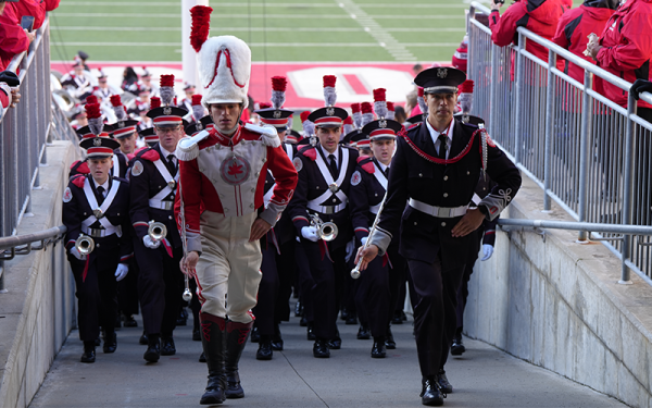 Drum majors and band marching up the ramp