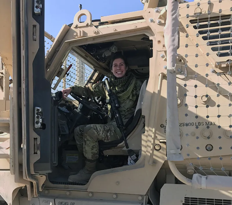 Sarah Wood in a military vehicle