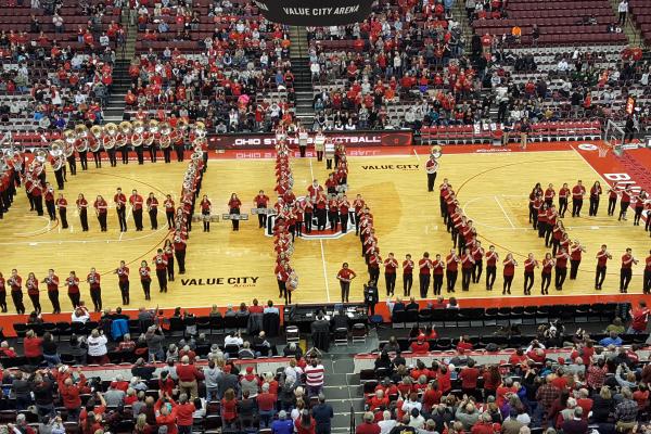 The Ohio State Athletic Band performs Script on Court at the women's basketball game on Feb. 1