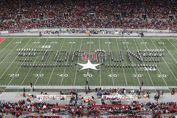 Marching band forms the Top Gun logo