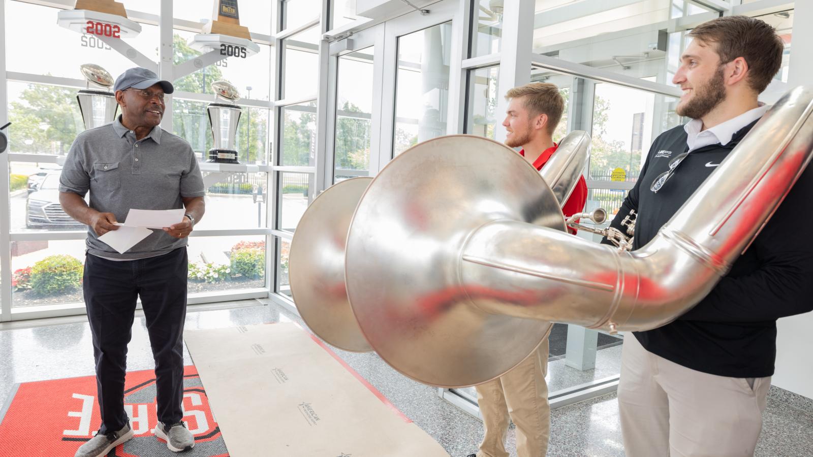 Archie Griffin reading invitation to Dot the "i"